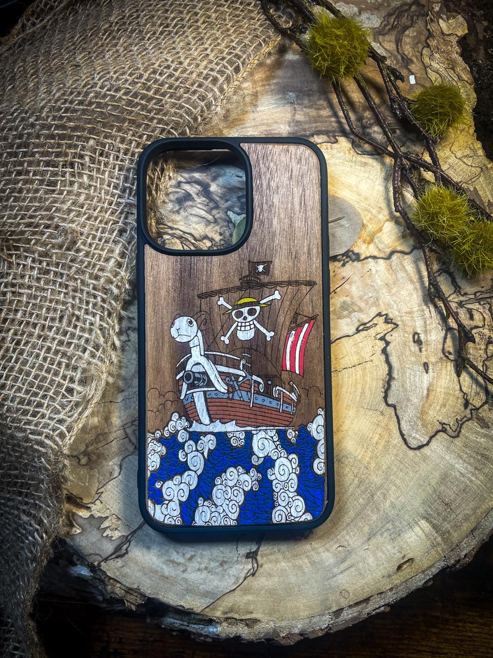 a wooden phone case with a pirate ship on it