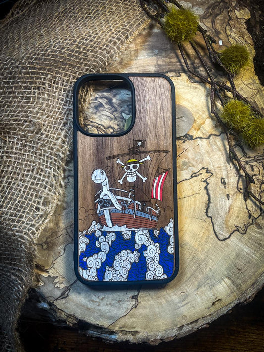 a wooden phone case with a pirate ship on it