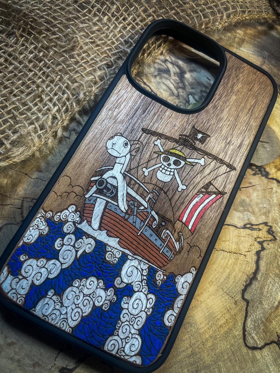 a wooden phone case with a picture of a pirate on a ship