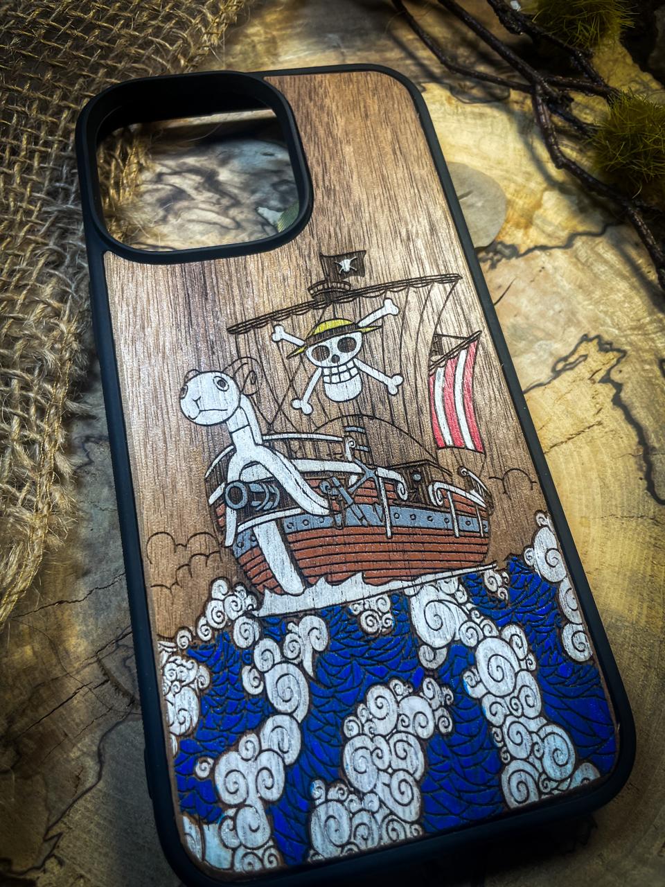 a wooden phone case with a pirate ship on it