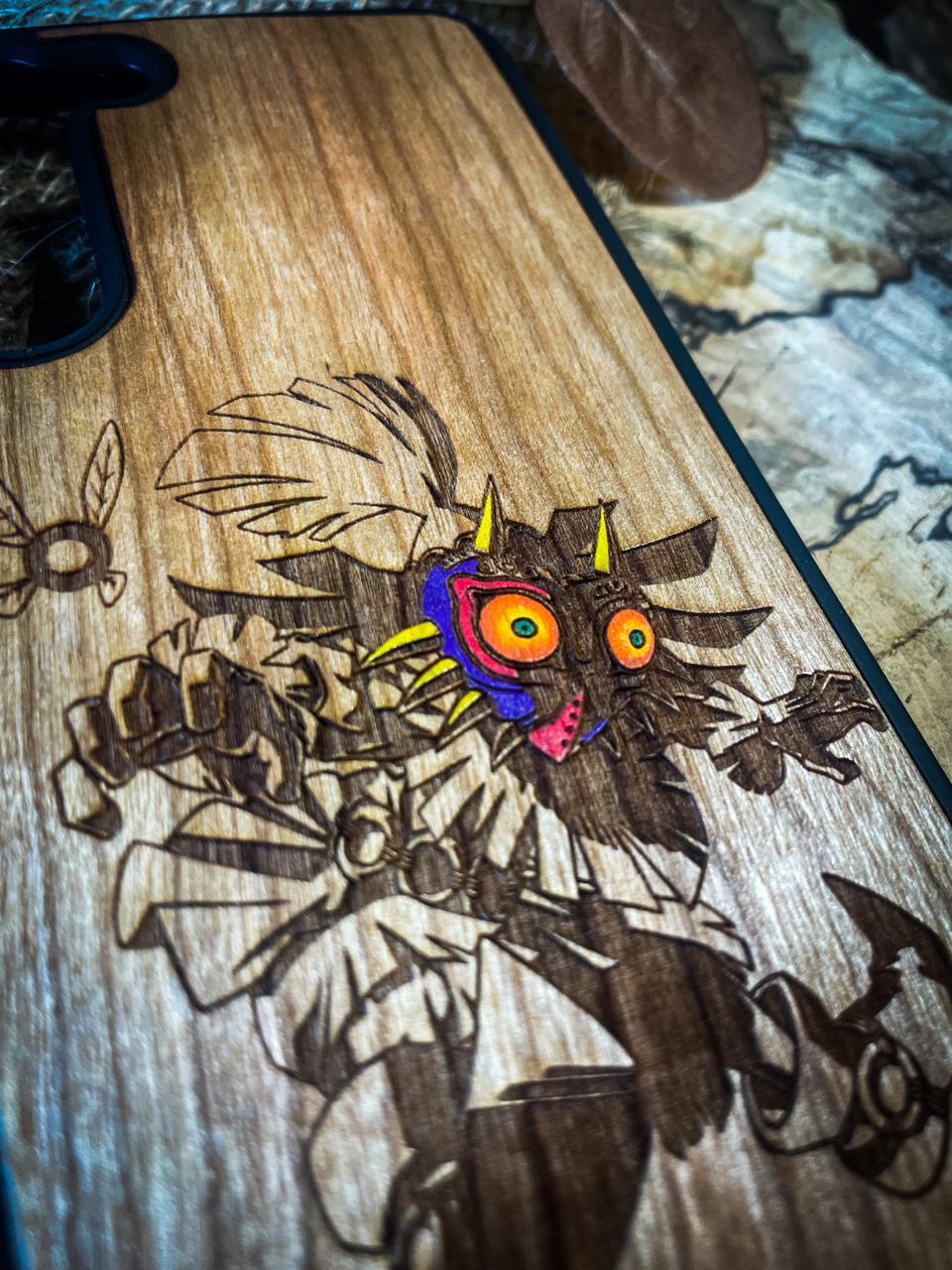 a wooden cutting board with a picture of a demon on it