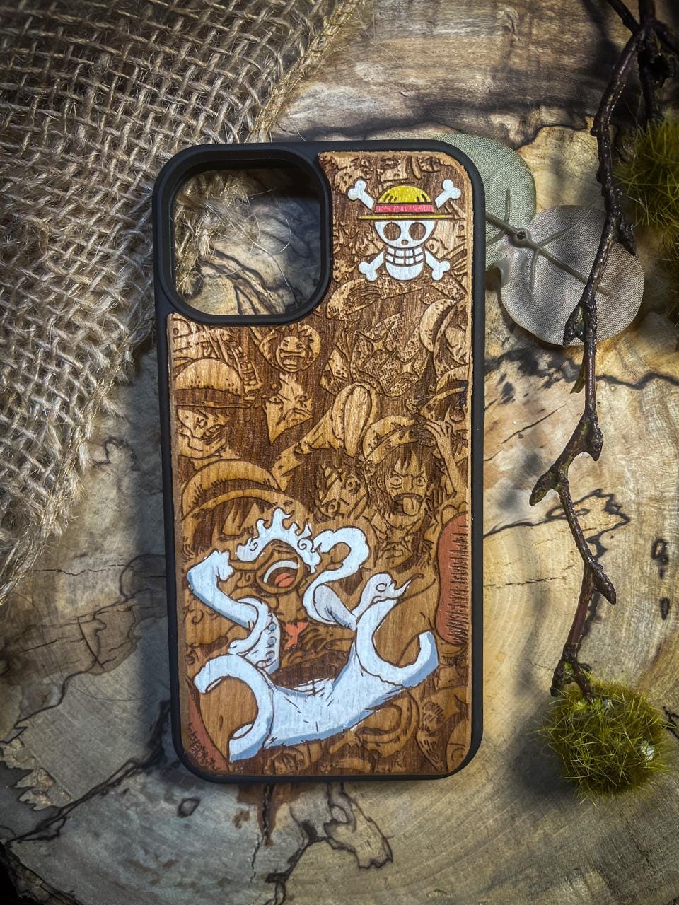 a wooden phone case with a picture of a dragon on it